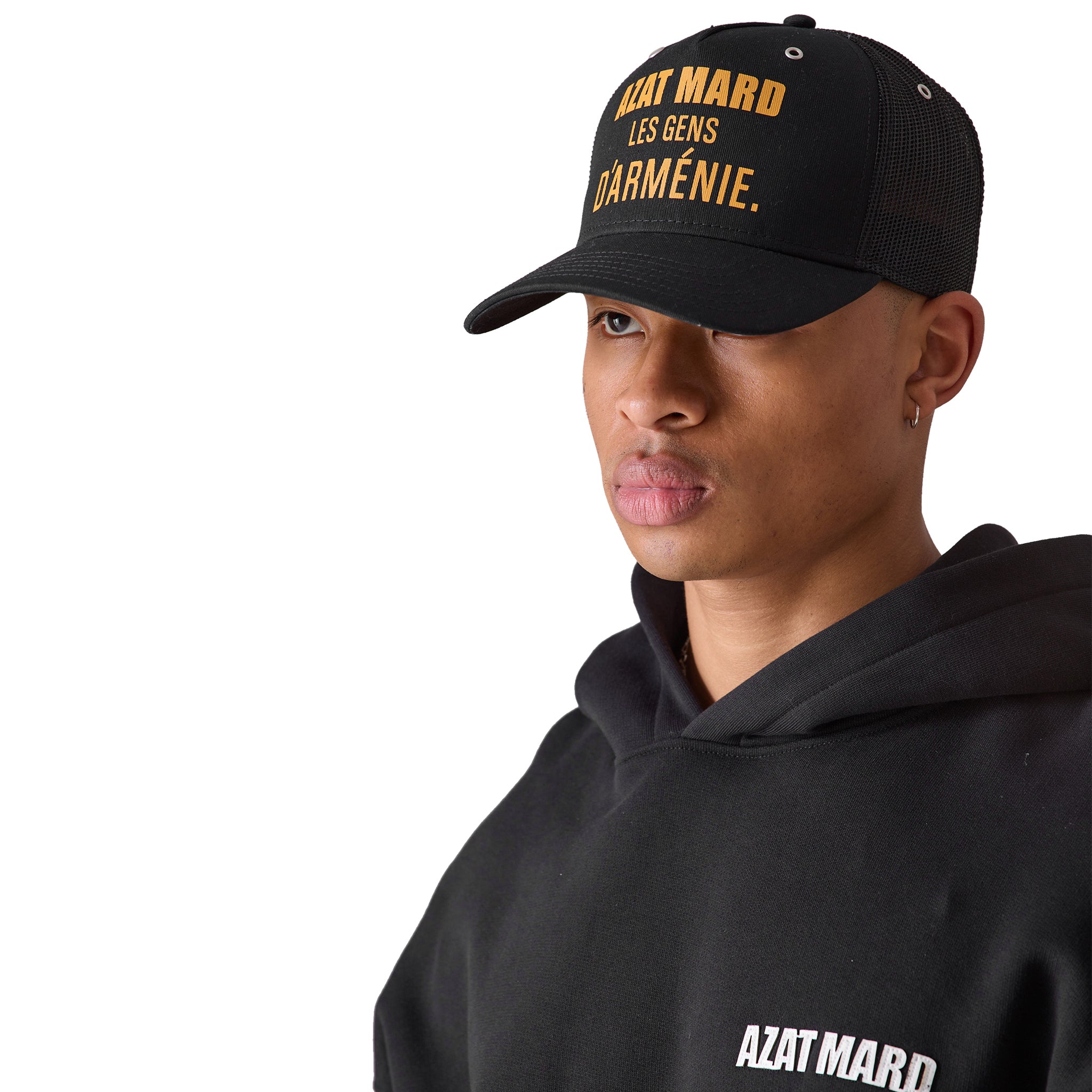 Model side view of Azat Mard Les Gens Trucker Cap Black JF03456
